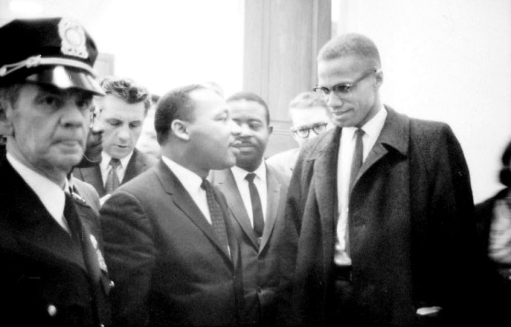 Martin Luther King Jr and Malcolm X shake hands